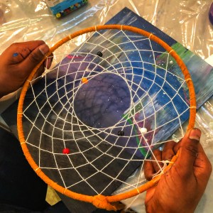 Unfinished reamcatcher held in hands.