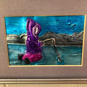 Metal art piece of Inuk ice fisher.